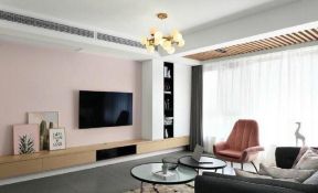 现代简约风格121平三居室客厅粉色电视墙设计图