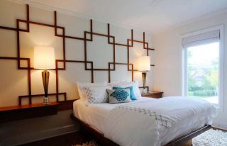 现代中式卧室床头背景墙造型装修案例图