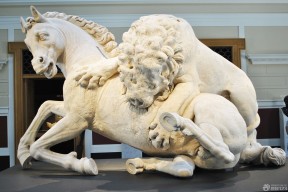 石狮子雕塑猎食造型设计图片