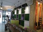 2023休闲食品店收银台背景墙设计装修效果图