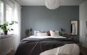 北欧风格卧室蓝色背景墙设计图片